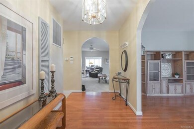 Foyer with Chandelier and Arched Doorway