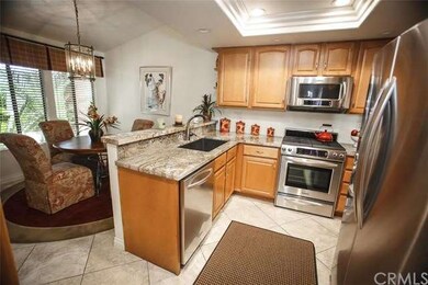 The beautifully remodeled kitchen features granite