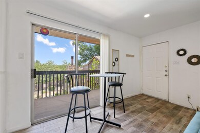 Foyer entrance featuring wood finished floors, ba