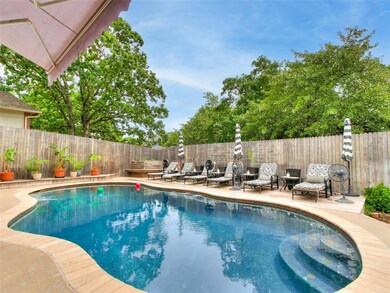View of pool with a fenced backyard and a patio