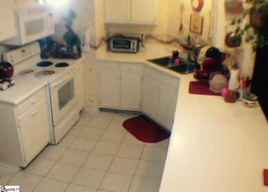 Open kitchen area with bar stool seating