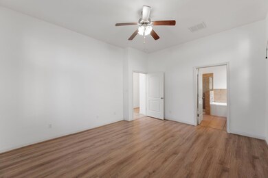 Unfurnished bedroom featuring visible vents, base