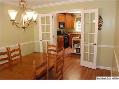 French doors seperate the kitchen from the spaciou