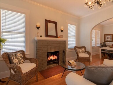 Note the vintage sconces above the fireplace!
