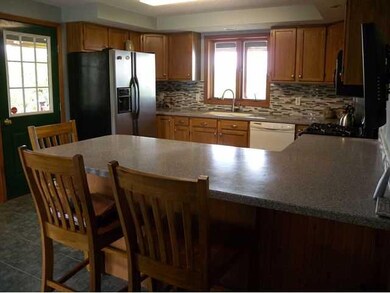 Kitchen. Kitchen is accessed from the covered porc