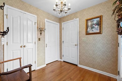 Large foyer to invite your guests. One door leads