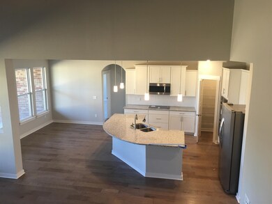 Not actual home, but same floorplan view of kitchen from stairs