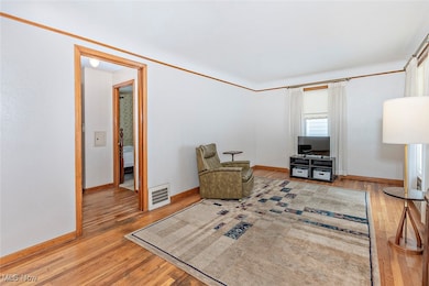 Living area with light wood-style flooring