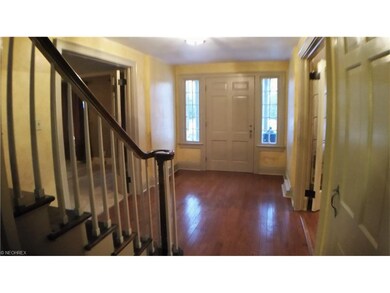 A wide foyer welcomes friends and family alike to 