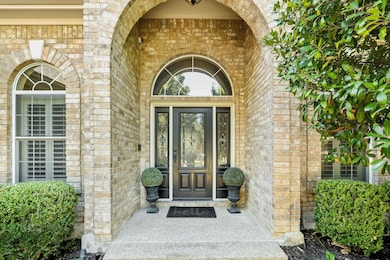 Property entrance featuring brick siding