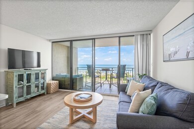 Living room featuring expansive windows, a water v