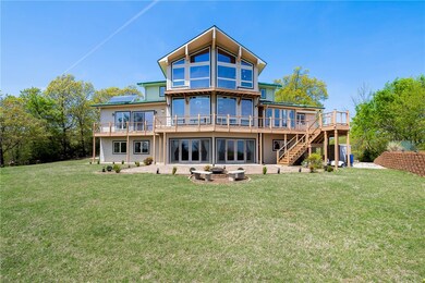 Lakeside of home. Windows with views in every room