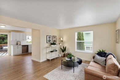 Nice floor plan with living room open to kitchen. Neutral tones and easy case laminate floors.