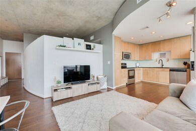 The urban feel of exposed concrete ceilings is bal