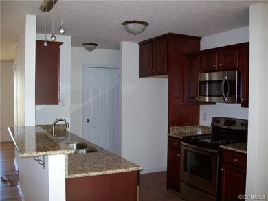 One kitchen cabinet, counter top, and appliance op