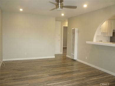 View of the living room from the front door.  The large kitchen is to the right.