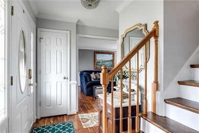 Alternate view of the foyer with crown moulding.