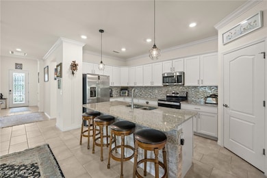 Kitchen with stainless steel appliances, a double