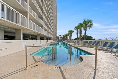 Community pool with a patio