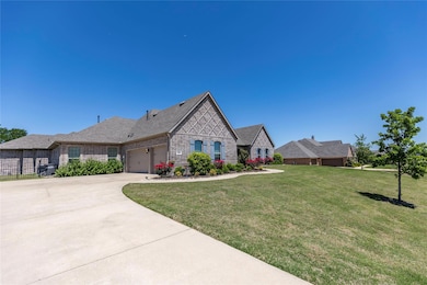 3 car garage and professionally landscaped.