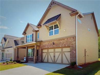 Craftsman inspired home featuring an attached gara
