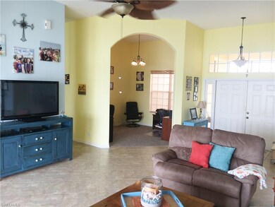 Living area with office/den in background.  Office