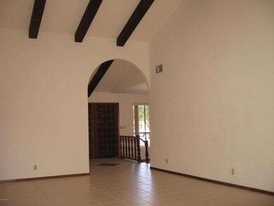Soaring, Beamed Ceilings in Family Room