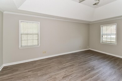 Unfurnished room featuring ornamental molding and wood finished floors