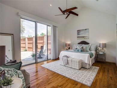 Soaring ceilings give this master bedroom a bright