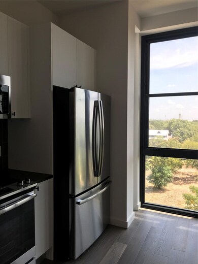 Kitchen with freestanding refrigerator, range, wo