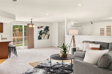 The entry cascades into the family room and kitchen.  A slider leads to the wrap-around deck.