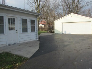 Side door into enclosed porch / sunroom.