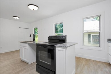 Remodeled kitchen with granite is...