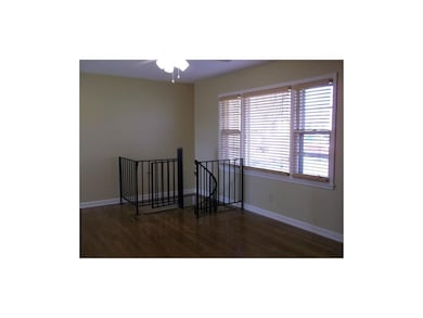 living room w/hardwood and ceiling fans