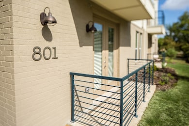 Entrance to property featuring brick siding
