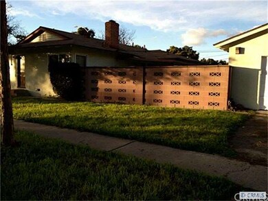 Side view of the home with detached garage and blo