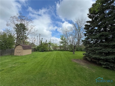 Huge yard with shed. Great for play area, corn hol