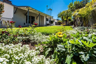 Gorgeous backyard with expansive covered patio and plenty of room to play and enjoy!