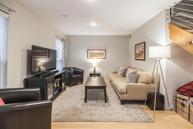 Living room featuring light wood-style flooring, 