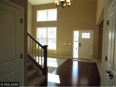 The two-story formal living room is located off th