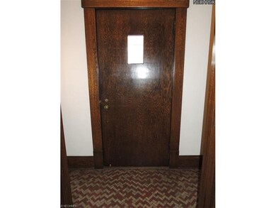 Note the original tile floor and nice solid hardwo