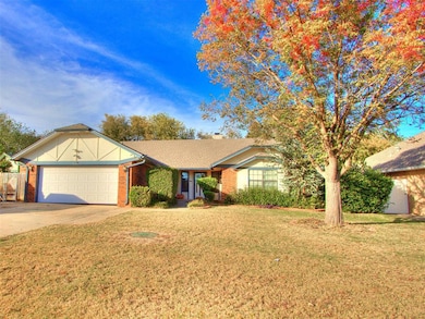 Ranch-style house featuring brick siding, a front yard, driveway, an attached garage, and a shingled roof