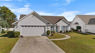 Ranch-style house with a garage, a front yard, and