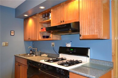 The updated kitchen has recessed lighting, a gas r