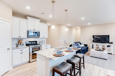 With nearly 6' of counter space at the island, there's plenty of room to pull up a chair! *All photos are of a staged model home- colors and options may vary.