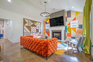 Living room featuring visible vents, baseboards, l