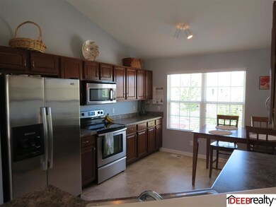 Big windows, stainless steel appliances, and gorgeous cabinets.