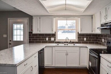 Applianced kitchen with a ton of counterspace.