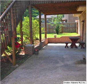 Patio covered partially by the deck and partially 