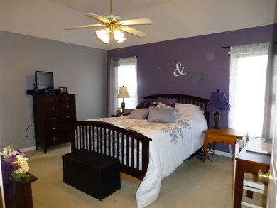 The master bedroom is spacious and has updated pai